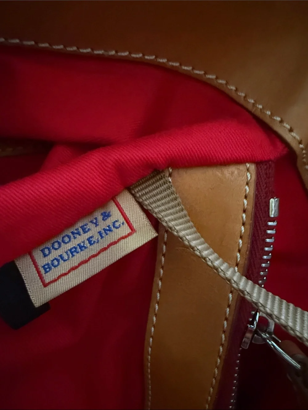 Dooney & Bourke Tote with Tan Leather Straps and Grommet Details